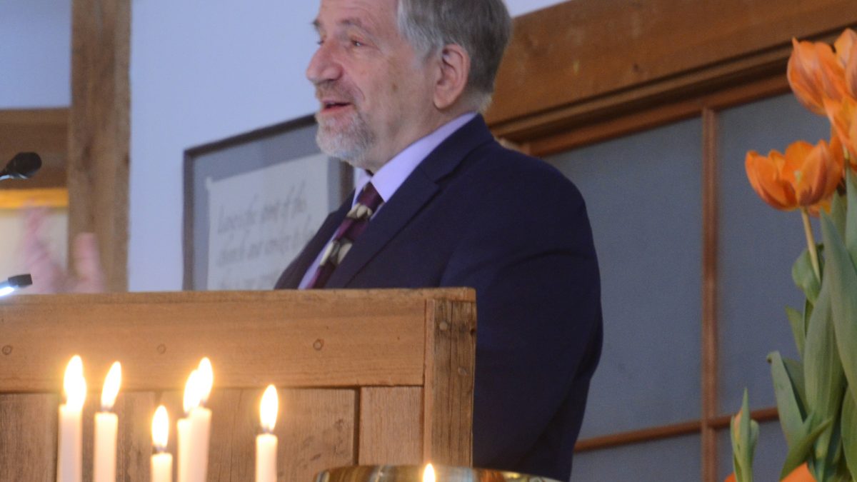 Losers One and All - Picture of Rev. Dr. Tony Larsen standing at the lectern.
